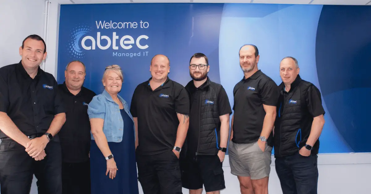 Wigan Business Awards organiser Nichola Howard with Phillip Millward and the Abtec team