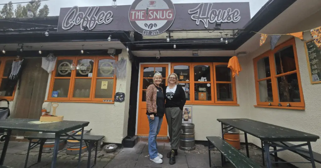 Nichola Howard and Rachael McEntee stood smiling outside The Snug Coffee House