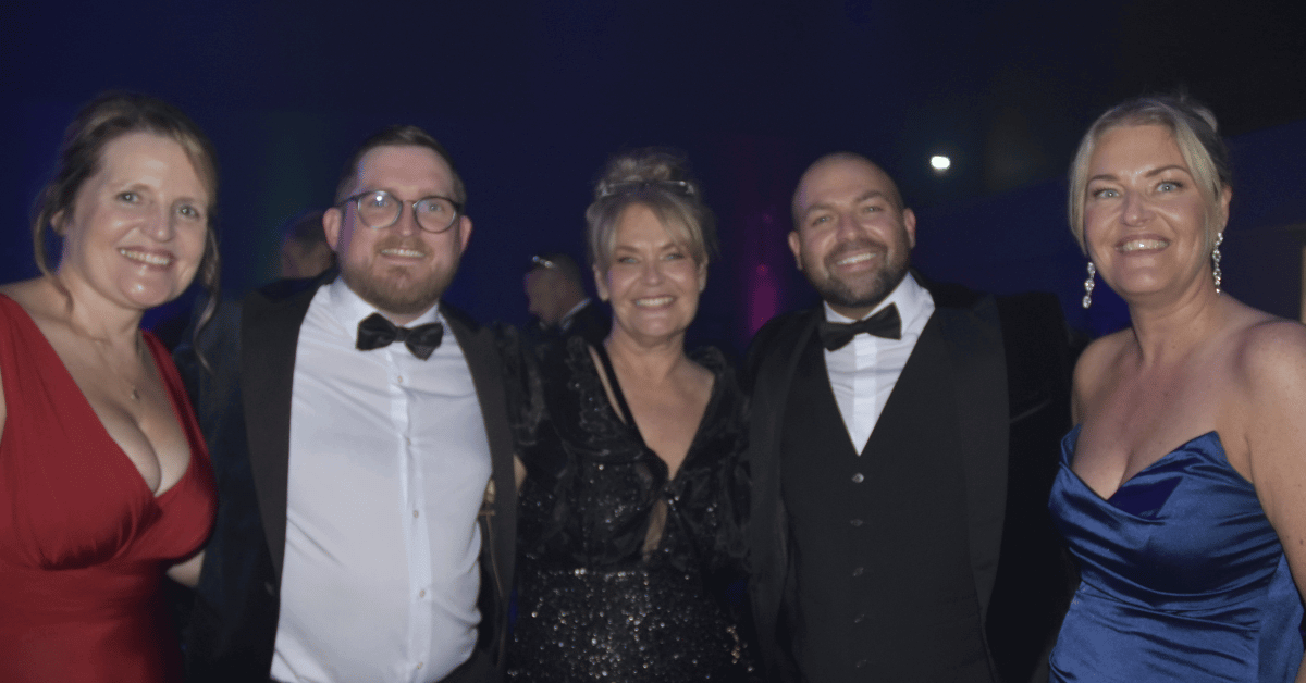 Image shows from L-R Janine Rees - Dan Morris - Nichola Howard - Alex Melling and Jo Leigh smiling at the Wigan Business Awards 2025