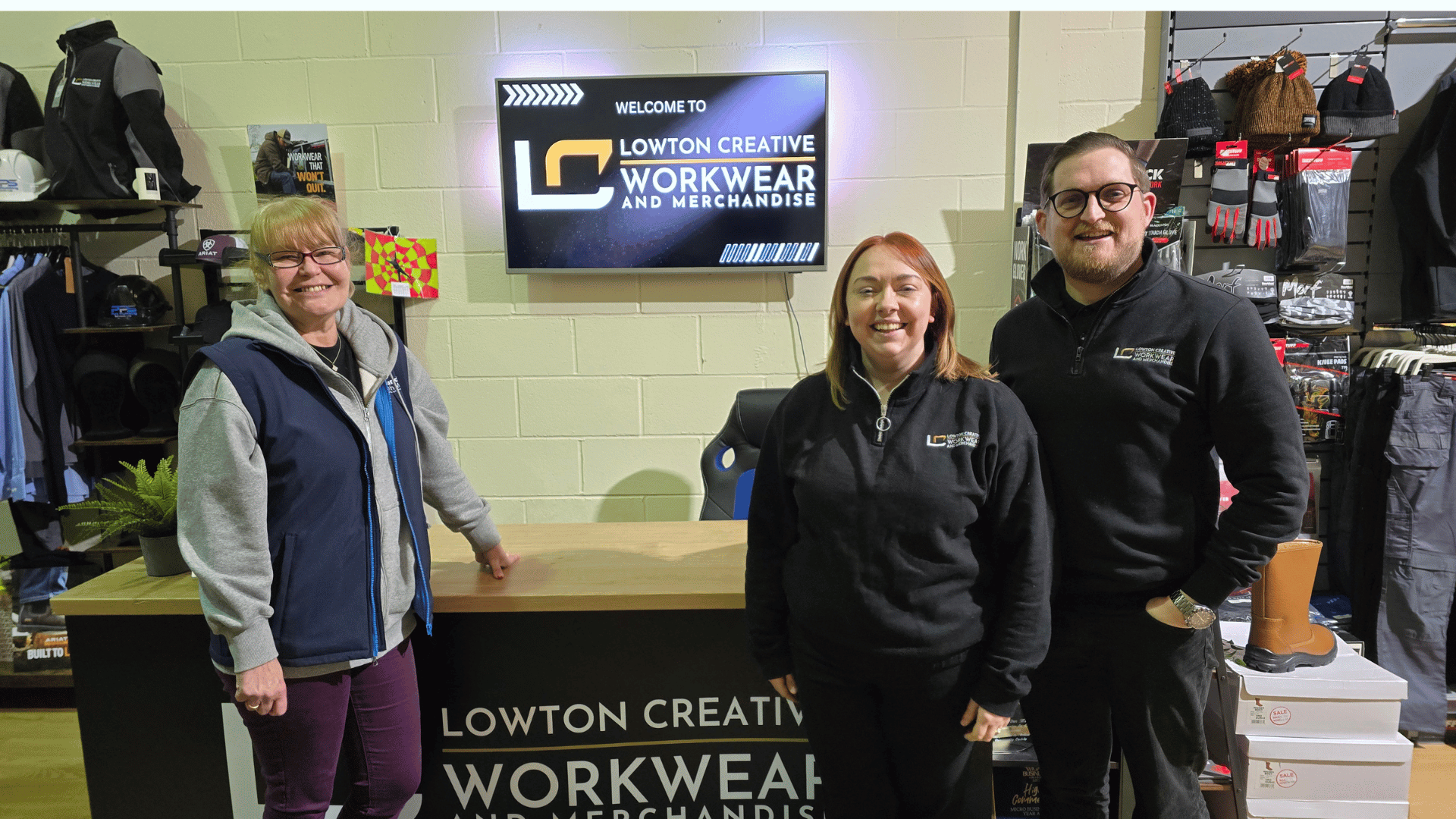 Nichola Howard stood Smiling with Nicola Morris and Dan Morris from Lowton Creative Branded workwear and merchandise