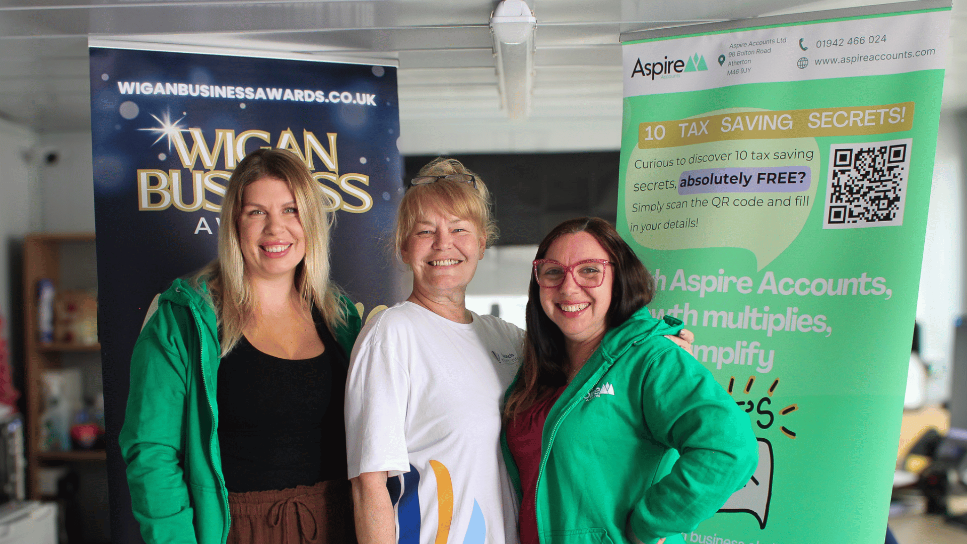 Wigan Business Awards sponsors Aspire Accounts stood smiling with Nichola Howard
