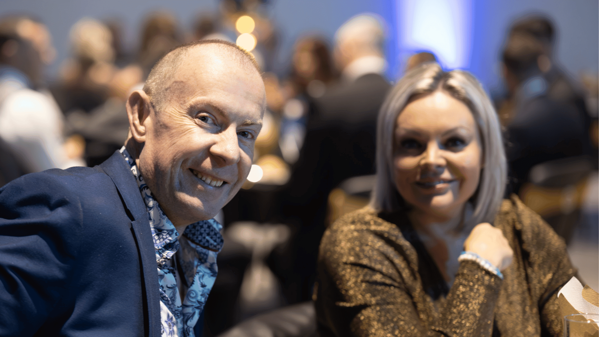 Two guests at Wigan Business Awards smiling